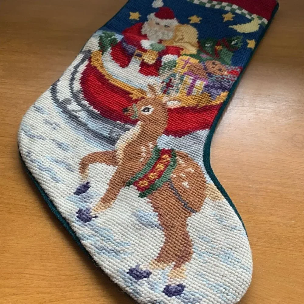 Vintage wool needlepoint Santa in a sleigh with a reindeer